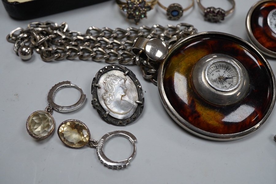 A collection of jewels, comprising: a coated topaz cluster ring in gold, stamped 9ct; a synthetic sapphire and colourless paste cluster ring in gold, stamped 9CT; an amethyst and colourless paste ring in silver, British